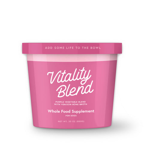 A container of Vitality Blend, which is a frozen vegetable blend for dogs, with text encouraging to 'Add some life to the bowl'.