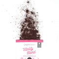 Green Juju Vitality Blend packaging with the freeze-dried vegetable blend spilling out on a white background