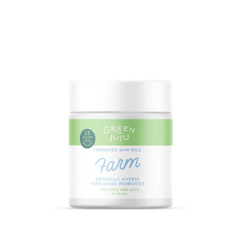 A container of Green Juju Farm Fermented Raw Milk Probiotic, with a white background and green and blue text detailing the product name and benefits.